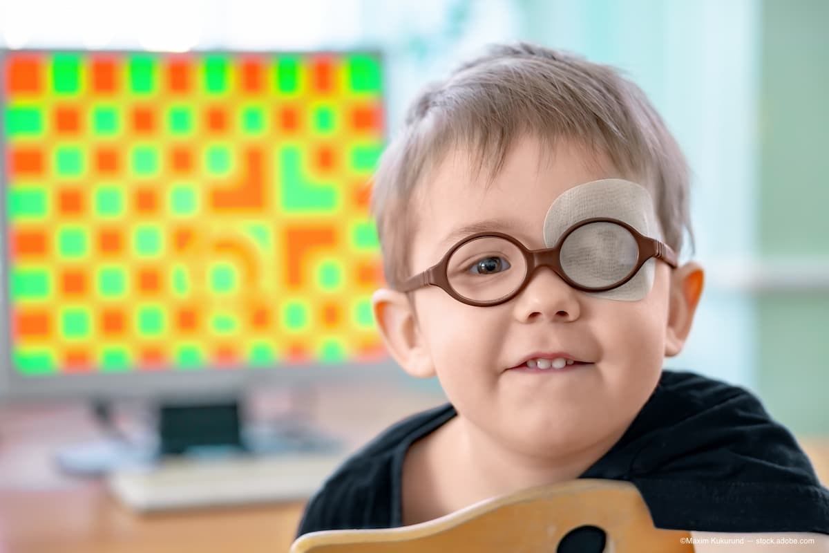 A child wearing glasses with an eye patch over one eye. (Image Credit: AdobeStock/Maxim Kukurund)