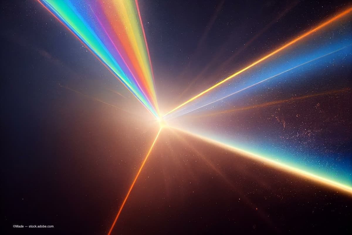 Light flare. Old film. Weathered overlay. Orange blue white rainbow color glow dust scratches noise on dark black illustration abstract empty space background(Image Credit: AdobeStock/Made)