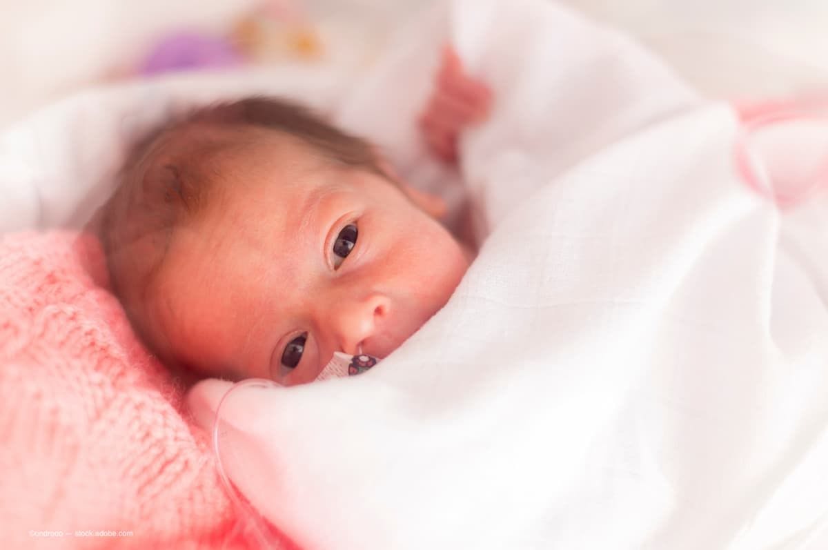 An image of a premature baby girl. (Image Credit: AdobeStock/ondrooo)