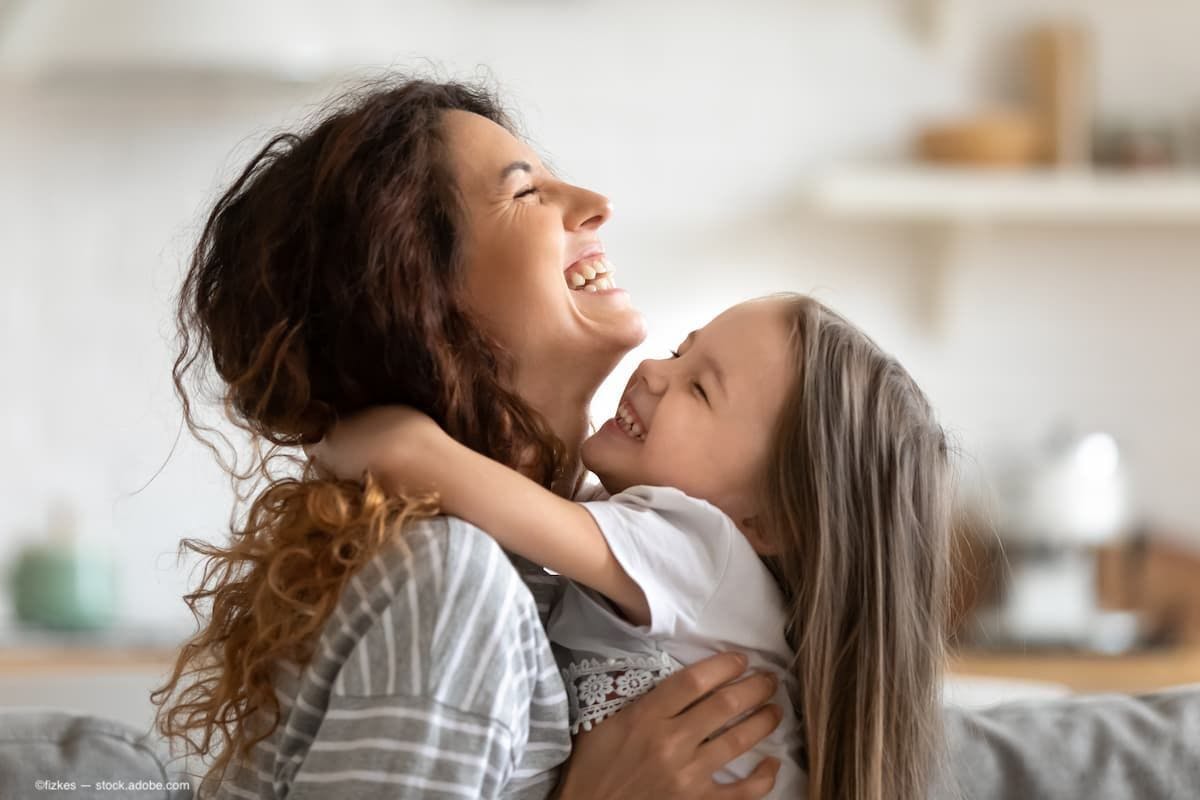 A mother and her daughter laughing (Image Credit: AdobeStock/fizkes)