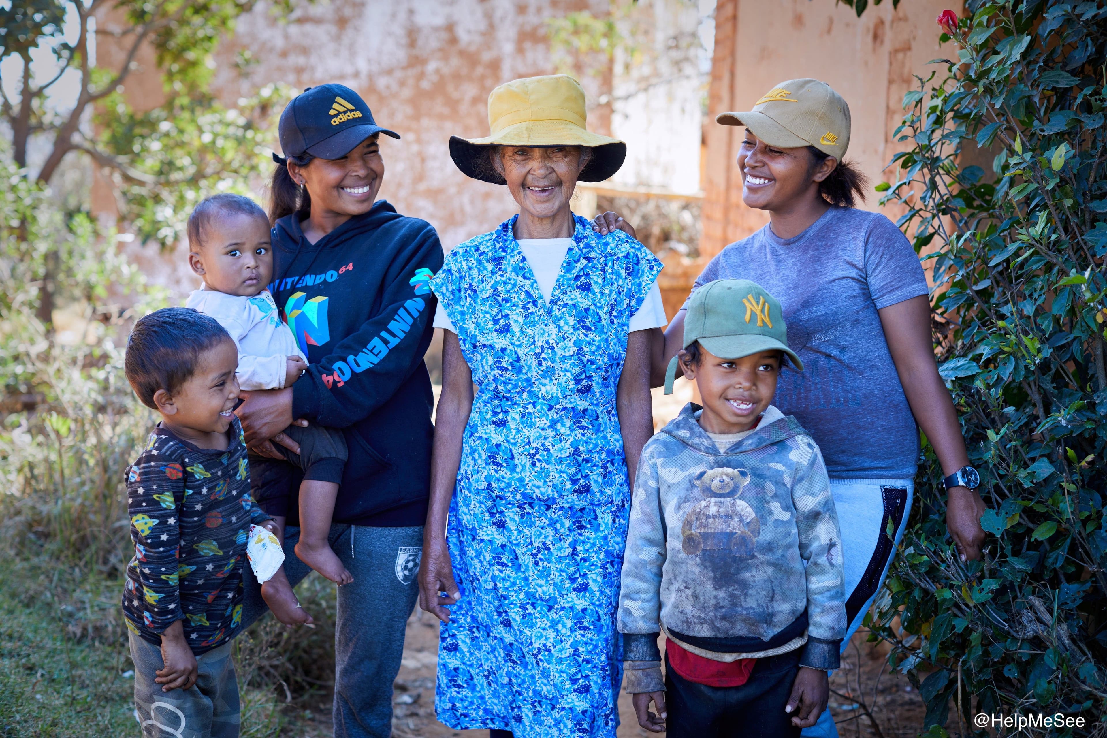 Patient Marie Henriette, center, is pictured with her family in Madagascar before her cataract surgery operation at the Vision Institute in Ambatomaro, Madagascar. (Image credit: HelpMeSee)