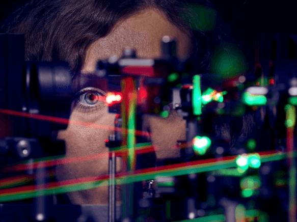 Study first author Jenny Witten is shown in front of the micro-psychophysical setup. (Image credit: MIB-Center at the UKB / Volker Lannert)